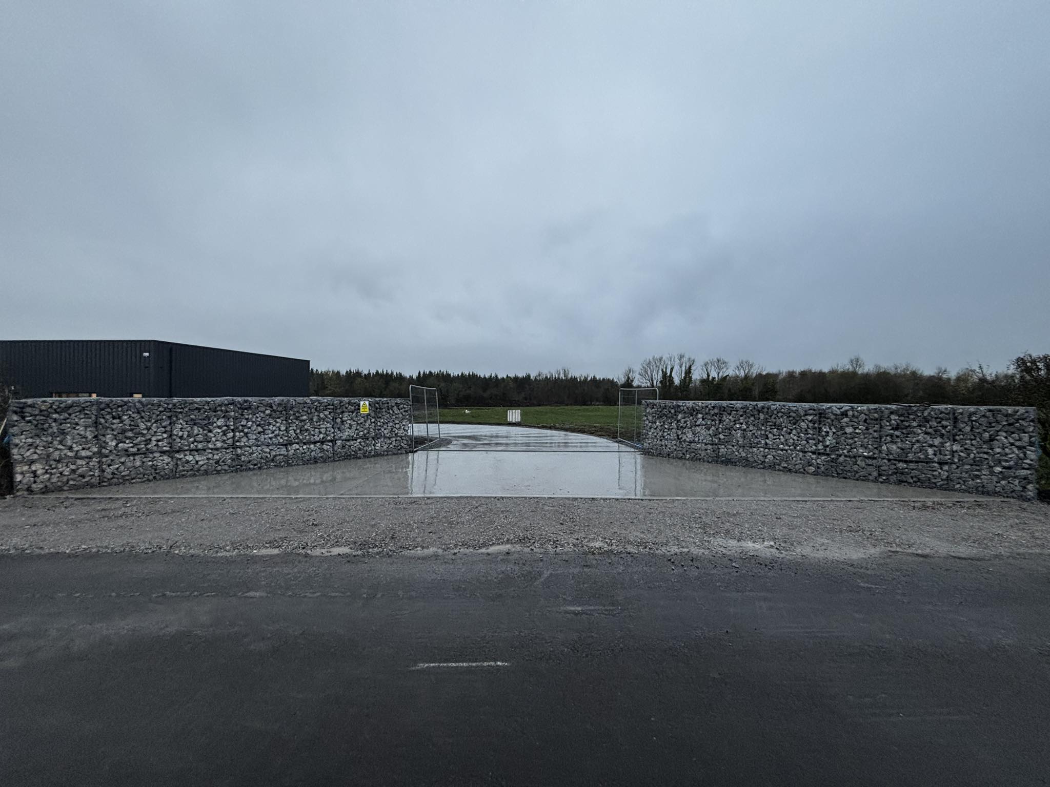 Stone gabion entrance landscaping